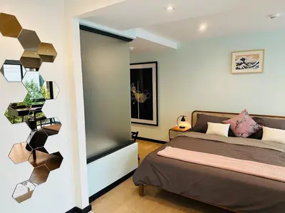 a bedroom with a bed and a window at Serene home in the heart of BKK - The Great Wave in Bangkok