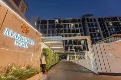 a sign for a marriott hotel in front of a building at Marigold Sukhumvit - Free Shuttle to BTS Bearing Station in Bangkok