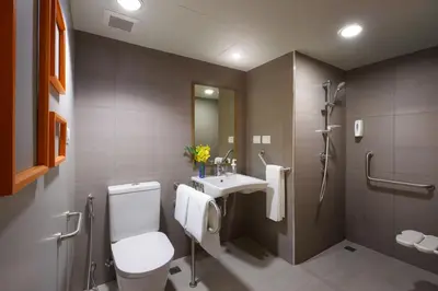 a bathroom with a toilet and a sink and a shower at Tinidee Trendy Bangkok Khaosan in Bangkok