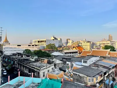 an overhead view of a city with buildings at Baan KhaoSoi - Private room in a rooftop hostel 2nd floor in Khlong San