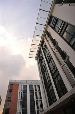 a tall building with windows on the side of it at Marigold Ramkhamhaeng in Bangkok