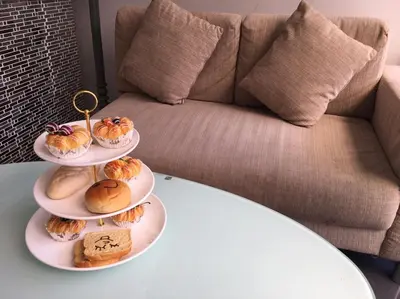 a table with three plates of pastries on them at Marigold Ramkhamhaeng in Bangkok