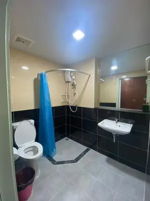 a bathroom with a shower and a toilet and a sink at ศิวพฤกษ์ เพลส in Nonthaburi