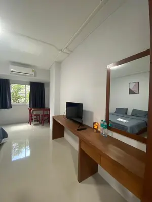 a room with a bedroom with a bed and a mirror at ศิวพฤกษ์ เพลส in Nonthaburi