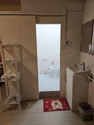a bathroom with a toilet and a sink and a shower at Hommie by De-A-Ga in Ban Bang Talat