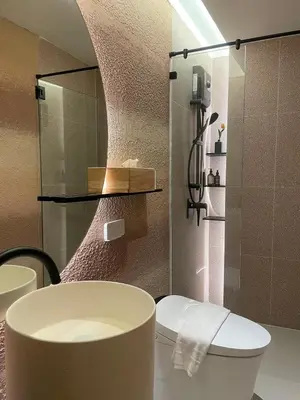 a bathroom with a toilet and a shower at Rema residence China town Main Road in Bangkok