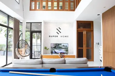 a living room with a couch and a table at Bangkok Luxury Pool Villa Thonglor in Bangkok