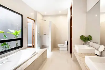 a bathroom with two sinks and a large window at Bangkok Luxury Pool Villa Thonglor in Bangkok