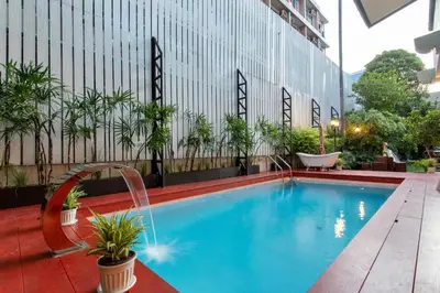 a swimming pool on the roof of a building at Sathorn Private Pool Villa in Bangkok