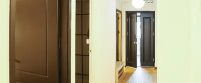 two views of a hallway with a door and a mirror at Hidden Gems in China town, 2BR in Bangkok
