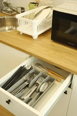 a kitchen drawer filled with utensils on a counter at 3BR in China Town, Rare to find 2 mins from MRT train in Bangkok