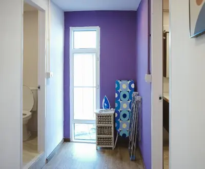 a bathroom with a purple wall and a toilet at 3BR in China Town, Rare to find 2 mins from MRT train in Bangkok