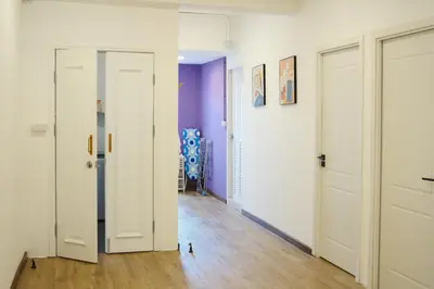 a room with two white doors and purple walls at 3BR in China Town, Rare to find 2 mins from MRT train in Bangkok