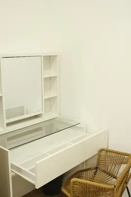 a glass desk with a chair and a mirror at 3BR in China Town, Rare to find 2 mins from MRT train in Bangkok