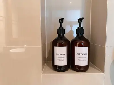 two bottles of wine sitting on a shelf at Residence on Sathorn CBD in Bangkok