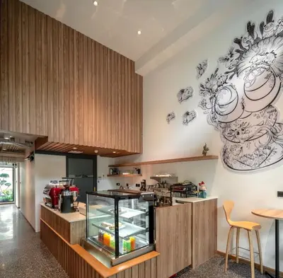 a kitchen with a display case in a room at ZEN MASTER HOTEL in Bangkok
