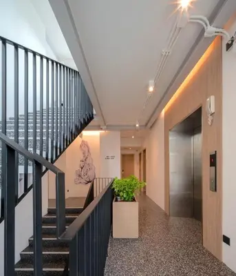 a staircase in a building with a stair case at ZEN MASTER HOTEL in Bangkok