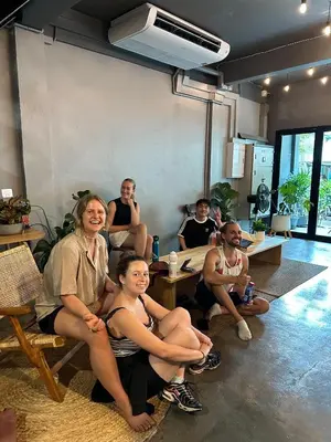 a group of people sitting in a room at Ti Thong Hostel in Bangkok