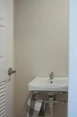 a bathroom with a white sink in a room at Private Full-Floor Spacious 5BR in China Town in Bangkok