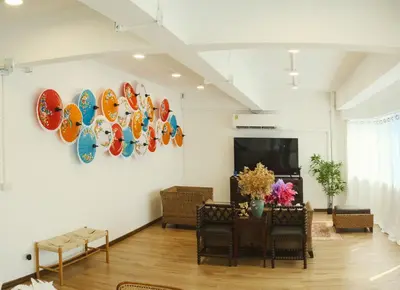 a room with a table and plates on the wall at Private Full-Floor Spacious 5BR in China Town in Bangkok