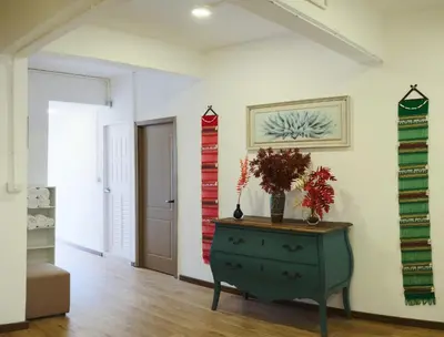 a room with a dresser with a vase on it at Private Full-Floor Spacious 5BR in China Town in Bangkok