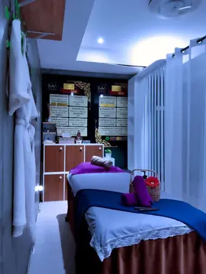 a bedroom with a bed with purple pillows at Guesthouse Bangkok BM B&B in Bangkok
