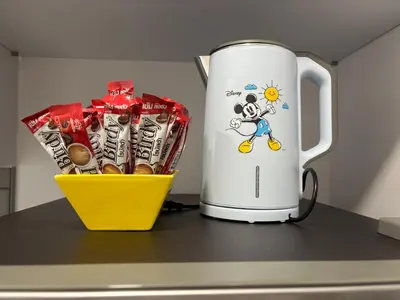 a container of chocolates is next to a white appliance at Sukhumvit​ 101 in Phra Khanong