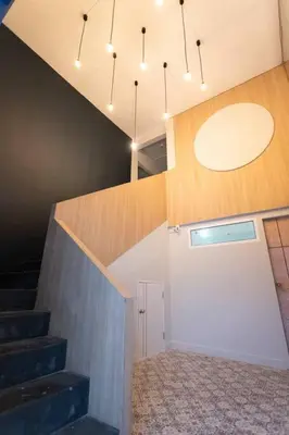 a room with stairs and a ceiling with lights at A3 Large Room, Full Facilities in Bangkok