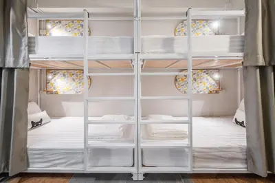 a bedroom with bunk beds in a room at Unplugged at Bangrak Design Hostel in Bangkok