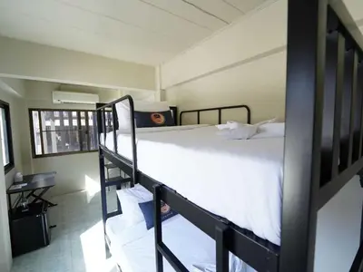 a bedroom with two bunk beds in a room at Dancenter Rq Bangkok Huai Khwang in Bangkok