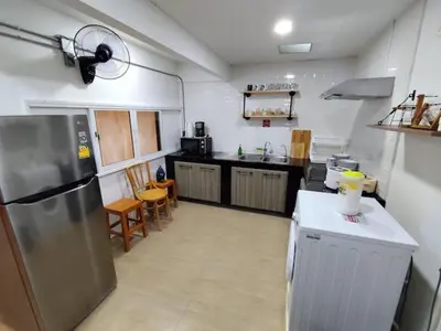 a kitchen with a stainless steel refrigerator in it at 4BR entire house next to Skytrain BTS and Subway MRT Chatuchak in Bang O