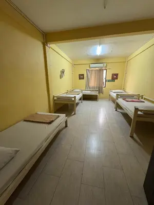 a room with three beds in a room with at wonderful hostel khaosan in Bangkok