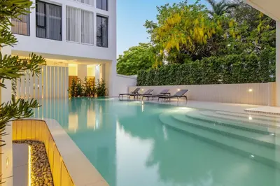 a swimming pool in the middle of a building at Saan Hotel Sathorn in Bangkok