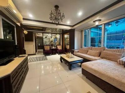 a living room with a couch and a tv at \u66fc\u8c37\u72ec\u680bLat Phrao\u7cbe\u54c1\u522b\u5885 in Bangkok