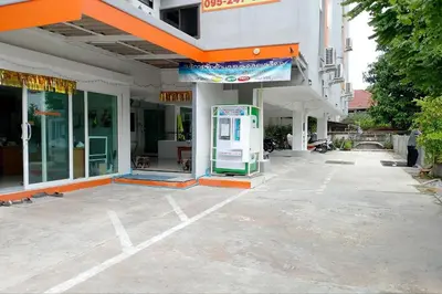a gas station in front of a building at Na Nont Place in Bangkok