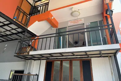 an external view of a building with a balcony at Na Nont Place in Bangkok