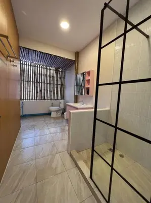 a large bathroom with a toilet and a sink at Roof Top 4BR Top Private Floor, china town, center in Bangkok