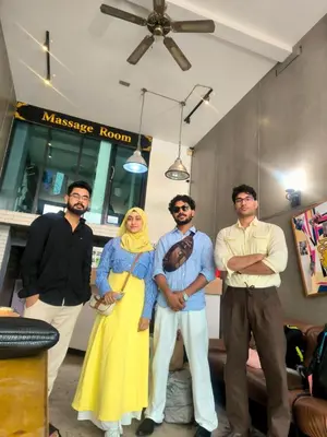 a group of men and a woman posing for a picture at Hostel Bangkok BM B&B in Bangkok