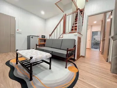 a living room with a couch and a table at Number9 Bangkoknoi BKK Homestay in Bangkok