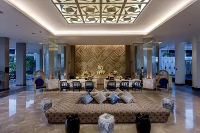 a hotel lobby with a couch in the middle at U Sathorn Bangkok in Bangkok