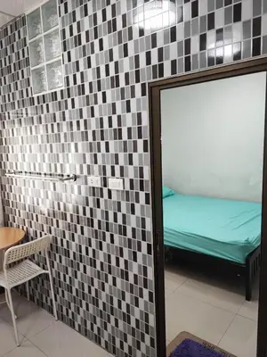 a room with a mirror and a bed in it at Mansion 24 in Bangkok