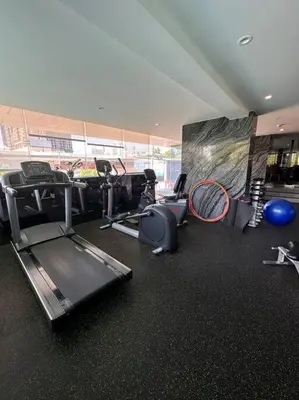 a gym with several exercise equipment in a room at Willow Whisper Nest in Bangkok