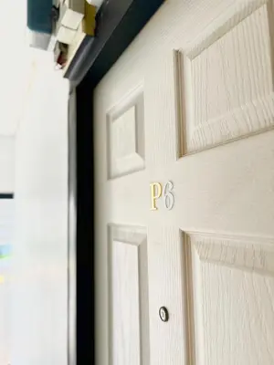 a garage door with the letter b on it at LSN Mansion in Bangkok