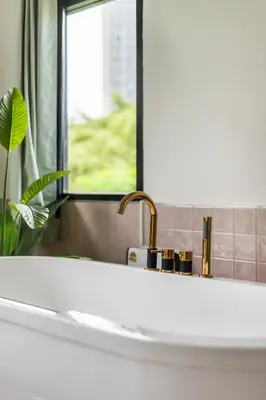 a bathroom with a sink and a mirror at MIQ Ekkamai1 - 5BR house 65 inch TV in Bangkok