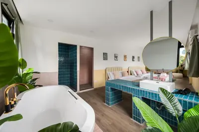 a bathroom with a sink and a mirror at MIQ Ekkamai1 - 5BR house 65 inch TV in Bangkok