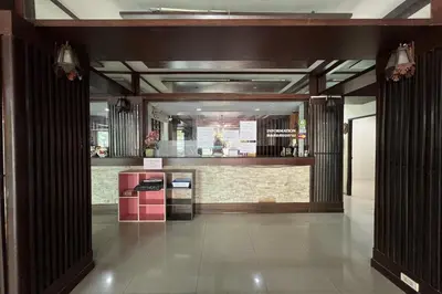 a lobby of a building with a counter in it at Phongsathon Mansion in Bangkok