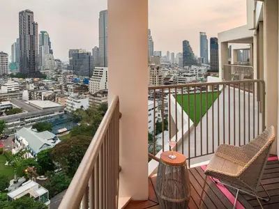 a balcony with a view of a city at Mercure Bangkok Surawong in Bangkok