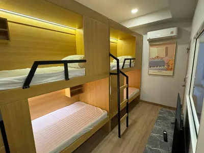 a small room with bunk beds in it at Pipp Residence in Bangkok