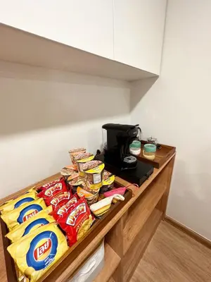 a counter with chips and other snacks on it at Bunya House near BTS Asok, Terminal21 Free BF in Bangkok