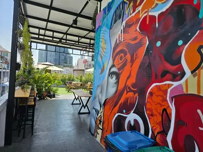 a mural on the side of a building at Urban Jungle Social in Bangkok